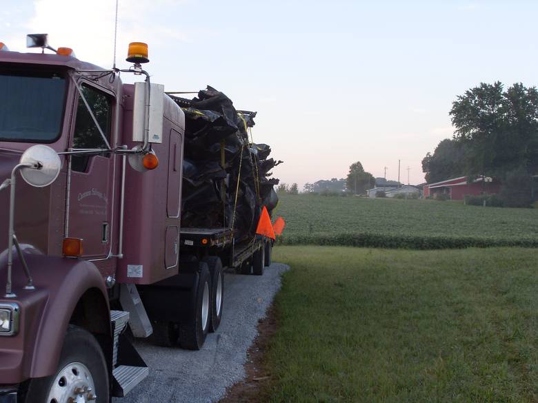 Harvestore Silos being Hauled in for Scrap